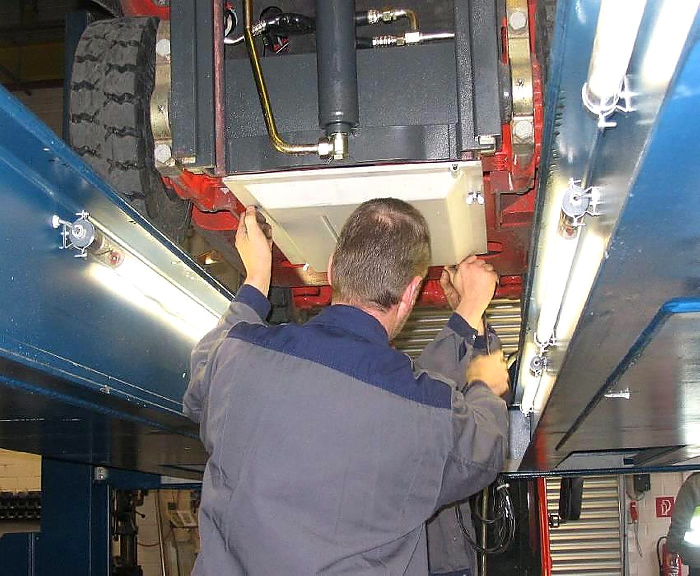 Technician installing Track+Race hardware